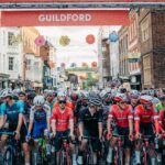 Sports cyclists lining up at the start of the race at the top of Guildford high street