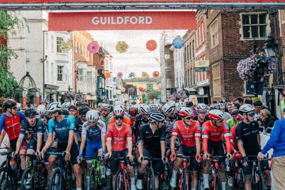 Sports cyclists lining up at the start of the race at the top of Guildford high street